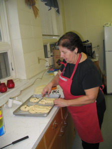 Trudi Wildfeuer preparing baked goods.