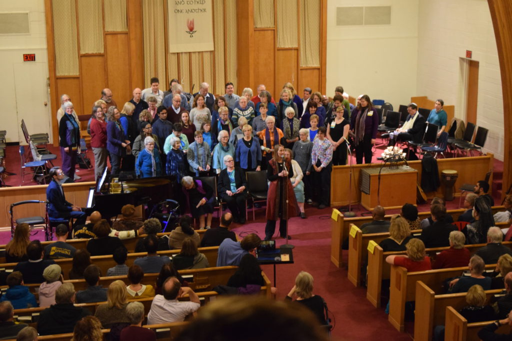 Chorus singing to congregation in sanctuary